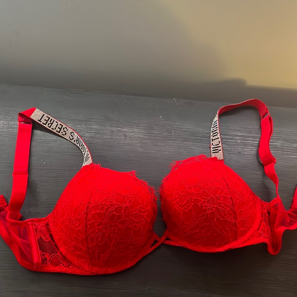 Victoria’s Secret red high push-up bra with rhinestone straps.